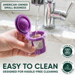 Purple reusable K-cup coffee filter being rinsed under a faucet, showing easy cleaning.