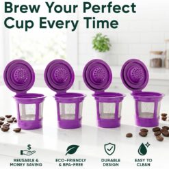 Four purple reusable K-cup coffee filter pods for Keurig brewers, displayed on a countertop.