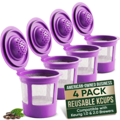 Four purple reusable Keurig K-cup filters with mesh bottoms and hinged lids.