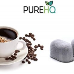 Cuisinart charcoal water filter replacement next to a cup of coffee. Universal fit for Cuisinart coffee makers.