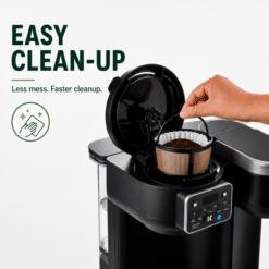 Keurig K-Duo coffee maker with a hand placing a coffee filter into the gold tone mesh basket.