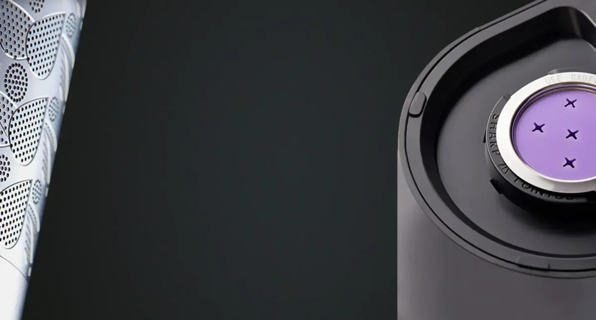 Close-up of a Keurig machine with a purple reusable K-cup filter inside.